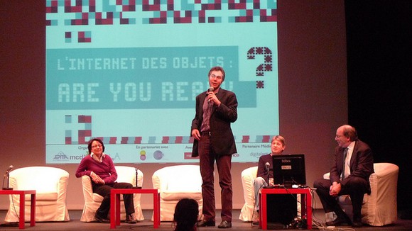 Picture of an Intel executive speaking at a global IoT conference.
