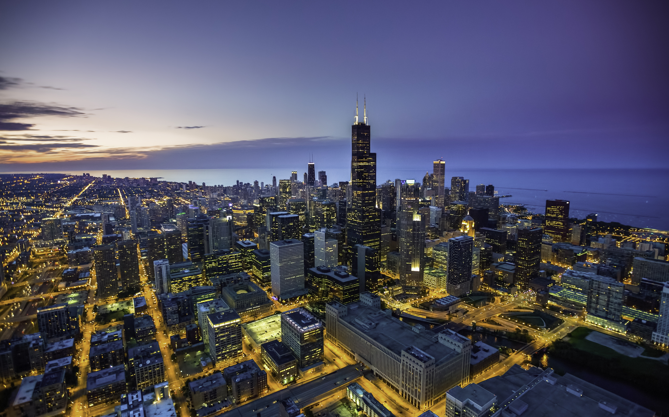 An aerial view of the Chicago skyline at dusk.