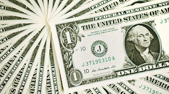 Fanned-out group of dollar bills