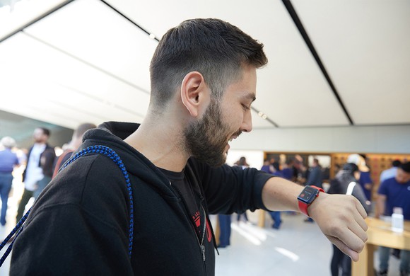 Customer looking at his Apple Watch Series 3 inside an Apple Store