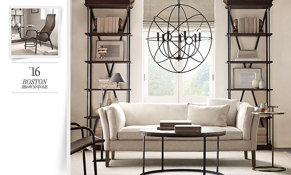 Living room suite with table, couch, shelves, and window hanging.