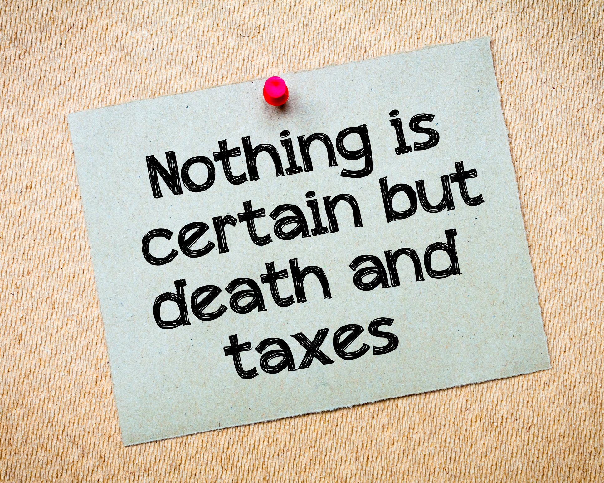 Pinned notecard reading "Nothing is certain but death and taxes"