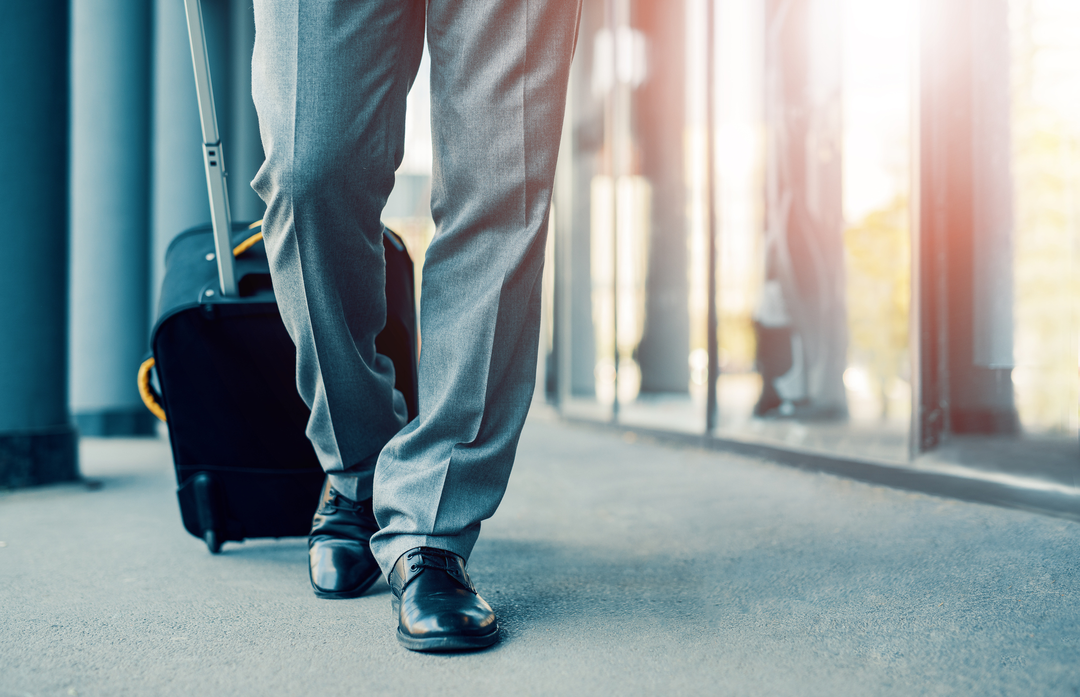 Man pulling suitcase