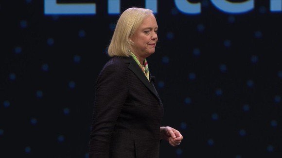 Meg Whitman on a stage under an Hewlett Packard Enterprise banner.