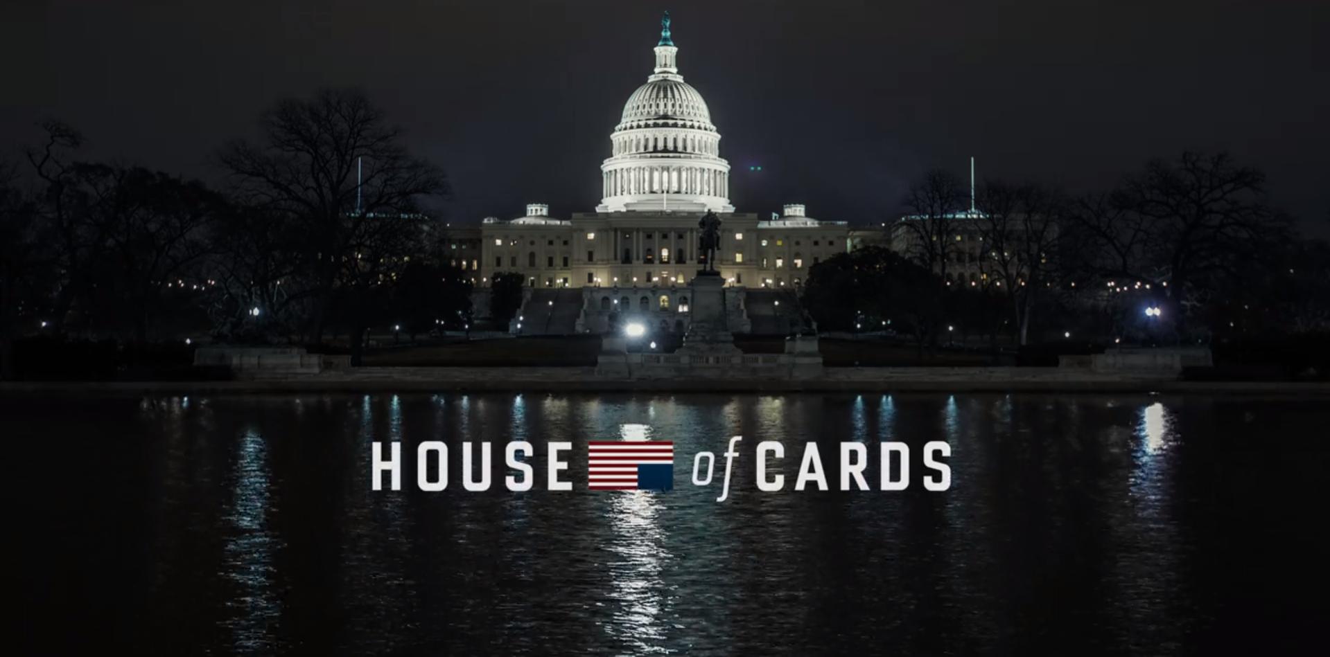The House of Cards logo in front of the U.S. Capitol building at night