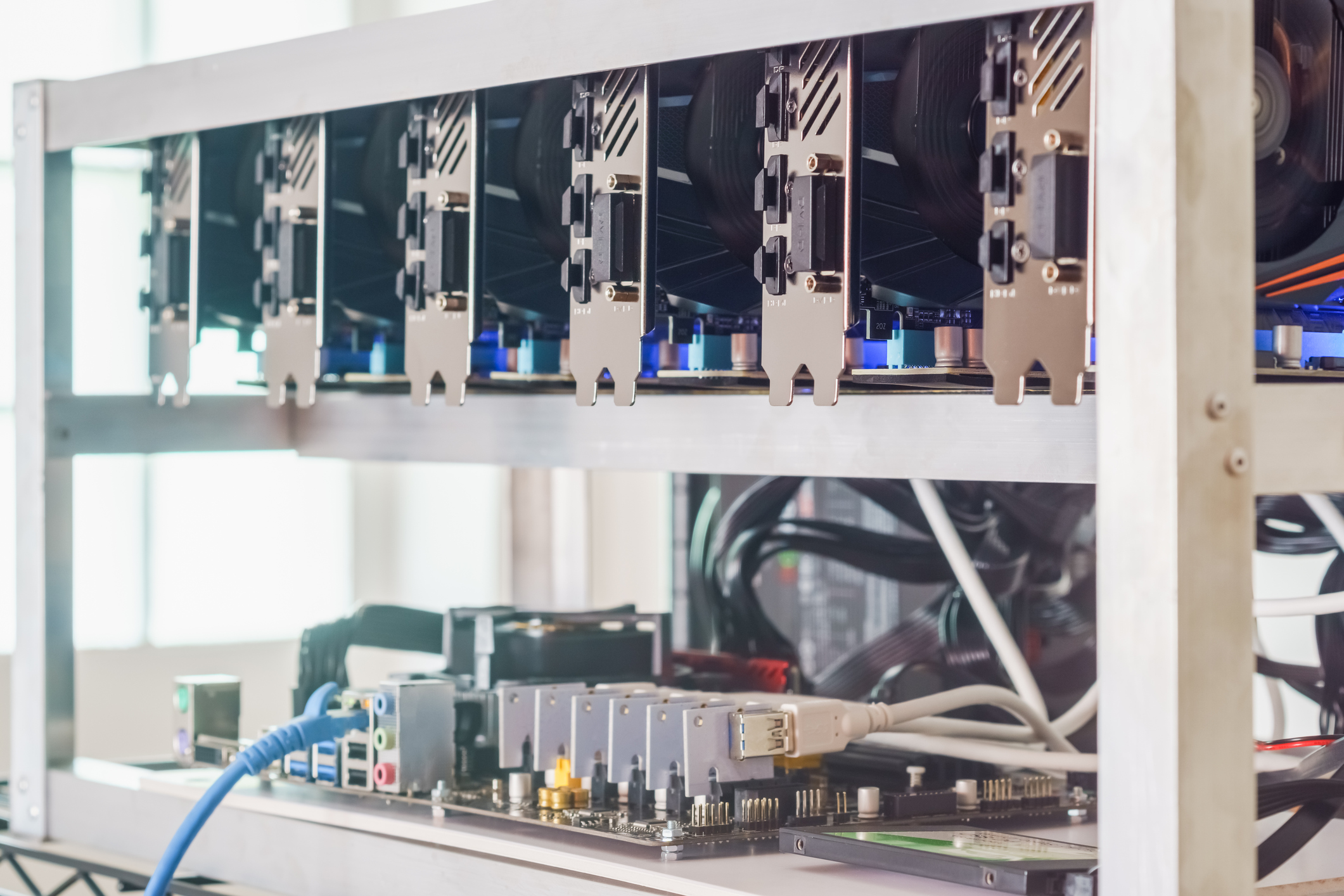A cryptocurrency mining rig, which shows six graphics cards. 