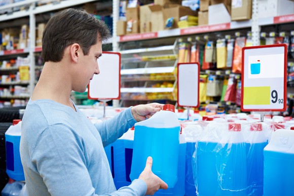 A customer buying wiper fluid.