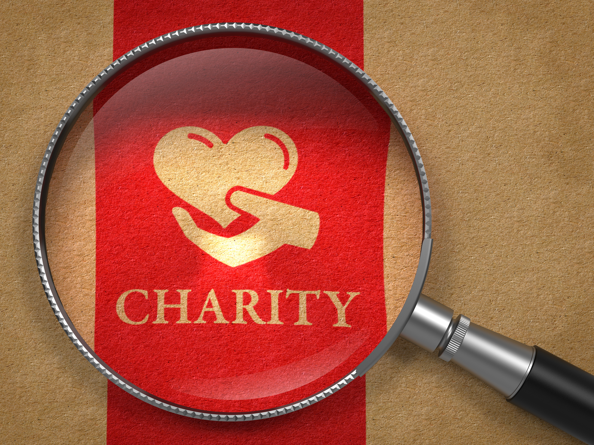 Red ribbon with charity and a hand holding a heart printed on it.