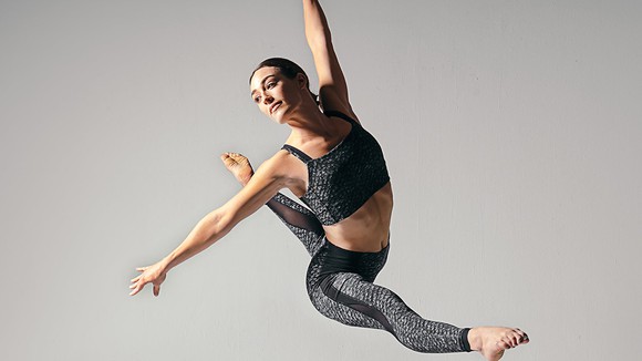Ballet dancer practicing while wearing Lululemon apparel.