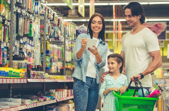 A couple shopping with their child.