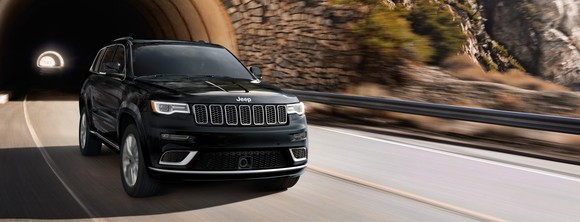A 2018 Jeep Grand Cherokee driving out of a tunnel.