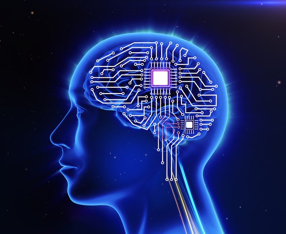 Human brain overlaid with a circuit board.