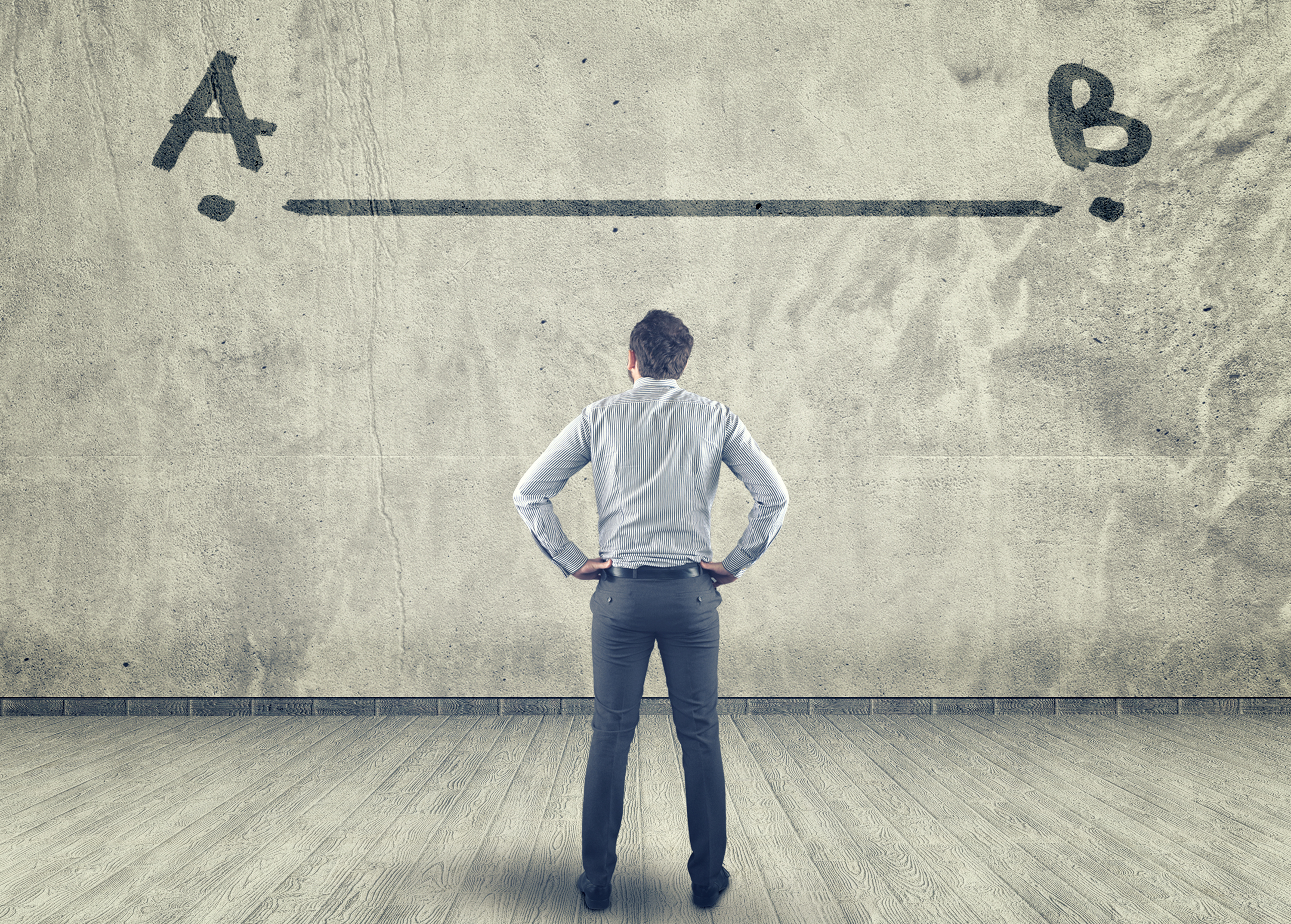 Man looking at wall with line on it