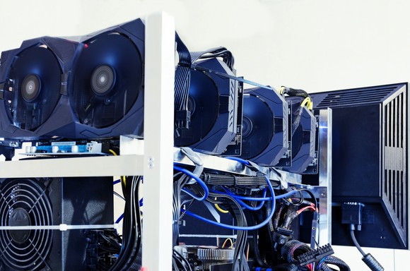 Hard drives and graphics cards set up to mine cryptocurrencies.