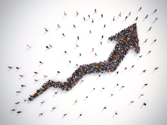 A an arrow made of people moving to the right and up