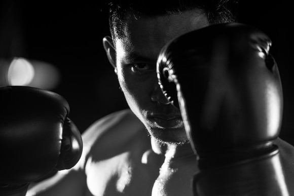 A boxer with his gloves up