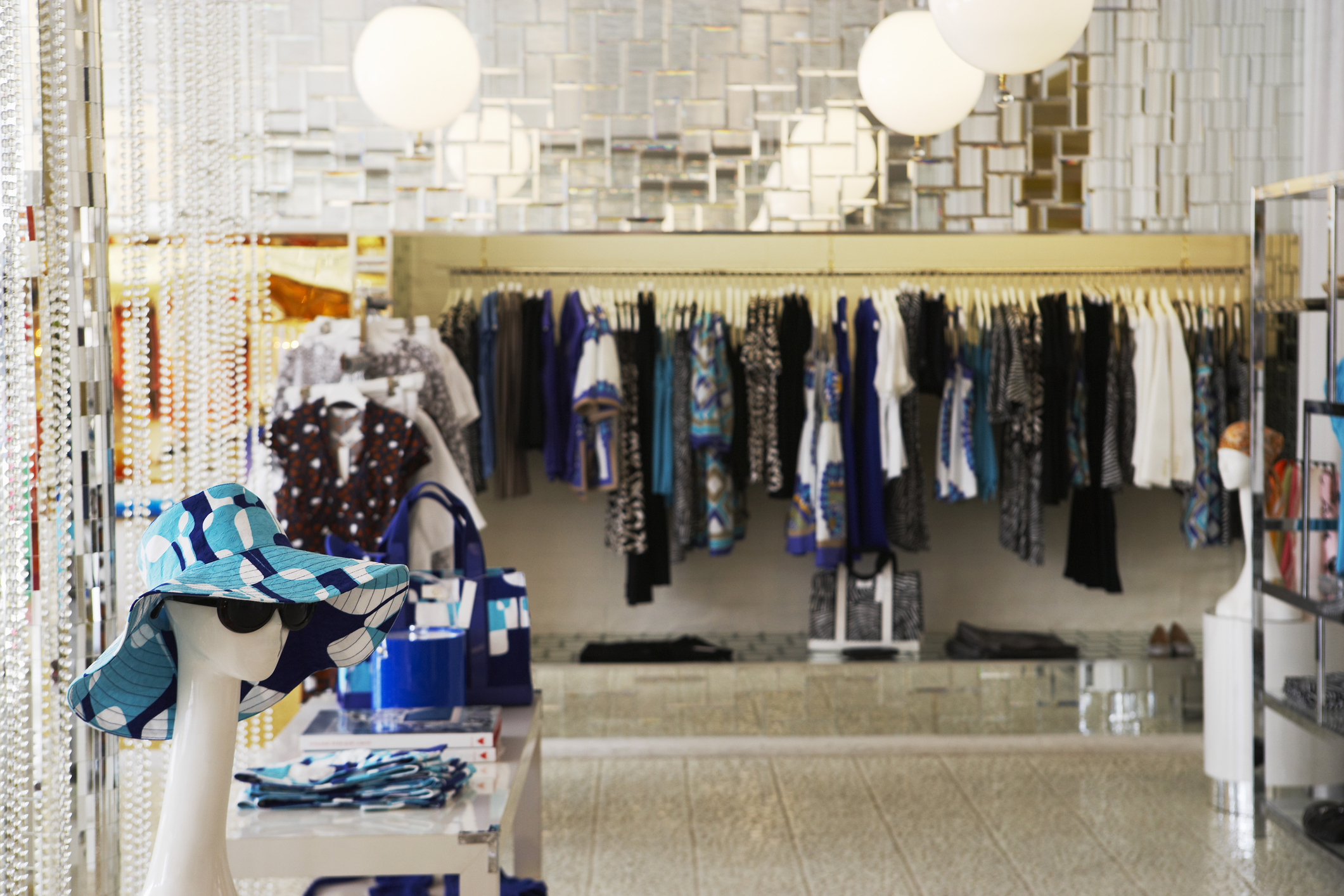 A variety of clothes displayed in a clothing store