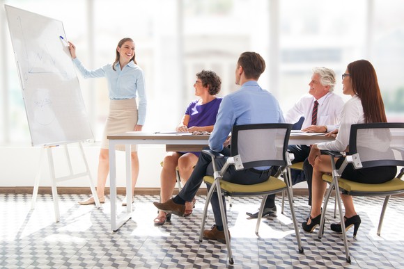 Professionals sitting through a presentation