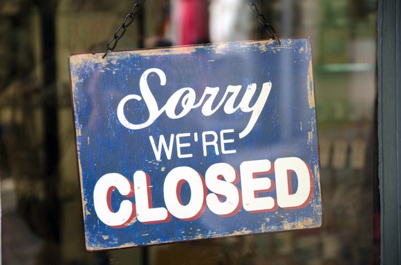 A sign reading "sorry we're closed."