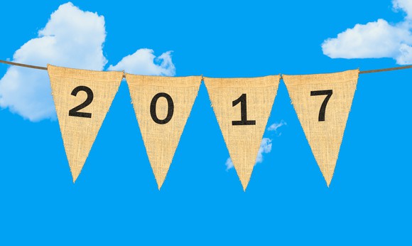 A horizontal rope with the year "2017" spelled out on four upside down triangle flags hanging from the rope.