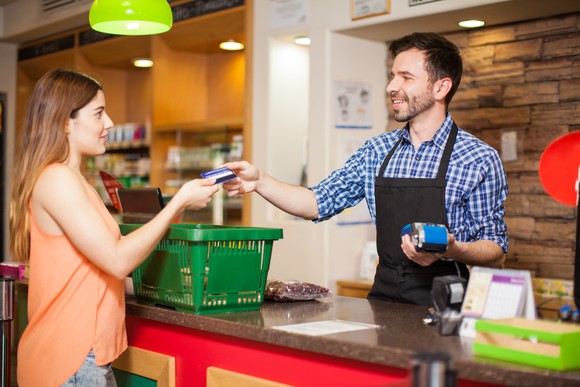 A clerk processes a customer's order.