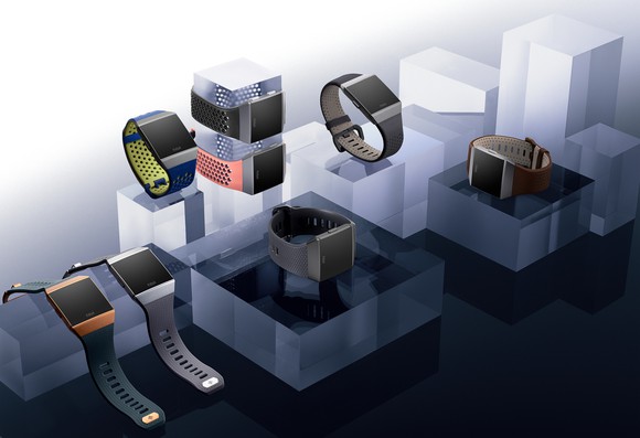 Fitbit smartwatches sitting on blocks.