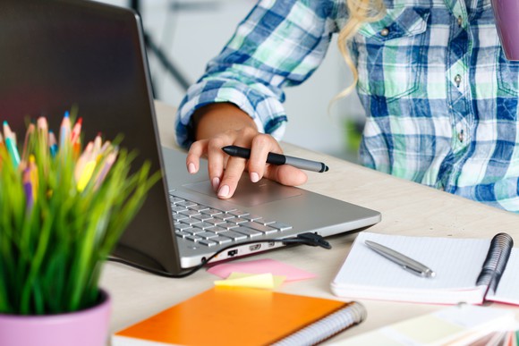 Woman's hand on a laptop