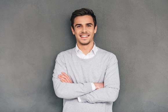 Smiling man against a gray background