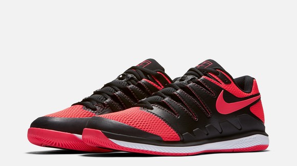 Red, black, and white Nike tennis shoe