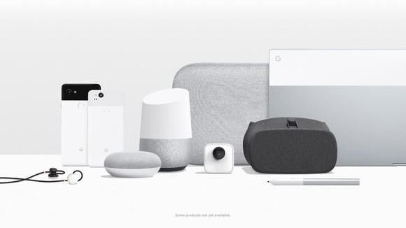 Google's Pixel hardware lineup. Two phones, a Pixelbook laptop, headphones, a pen, and various speaker and home assistants are displayed together.