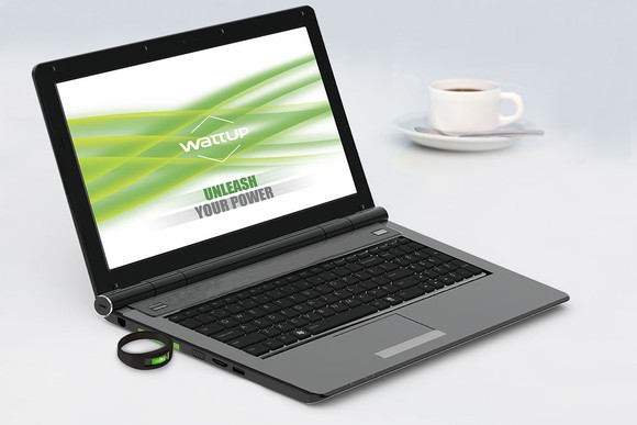 An Energous transmitter next to a laptop.