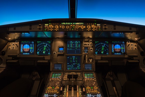 Cockpit of a jet, with various electronic instruments and other avionics.