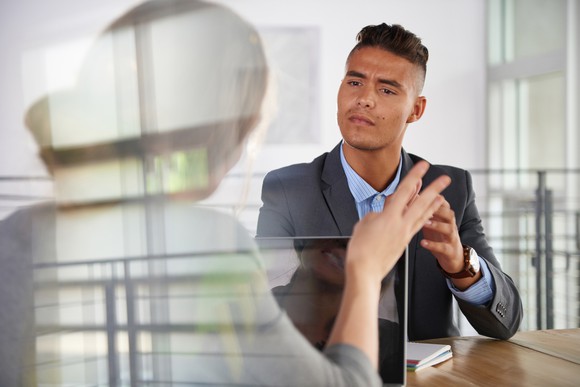 Professional man and woman in a meeting