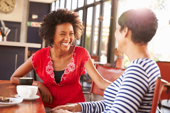 Two females talking and laughing