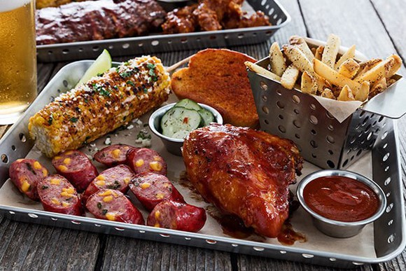 A platter of food including barbecue chicken and corn at Chili's.