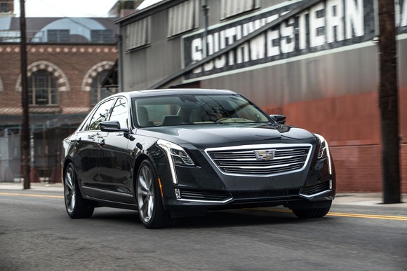 A black 2017 Cadillac CT6, a large luxury sedan, on a city street.