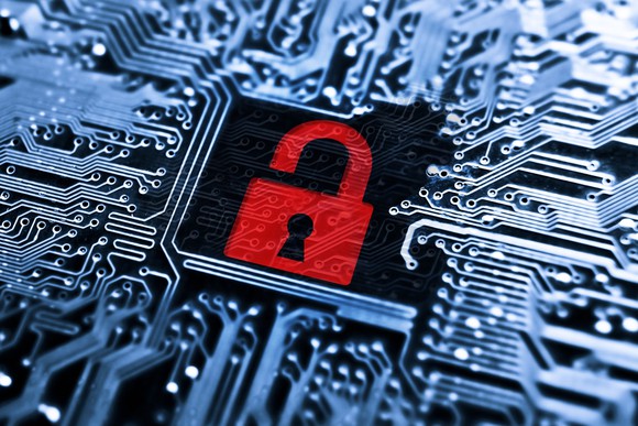 Open red padlock in a circuit board -- concept for computer hacking.