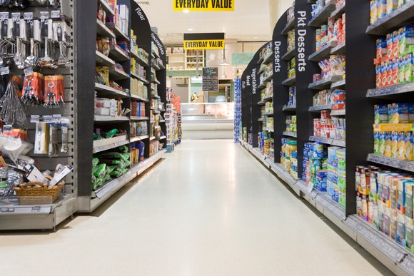 A retail store aisle with a variety of products in it.
