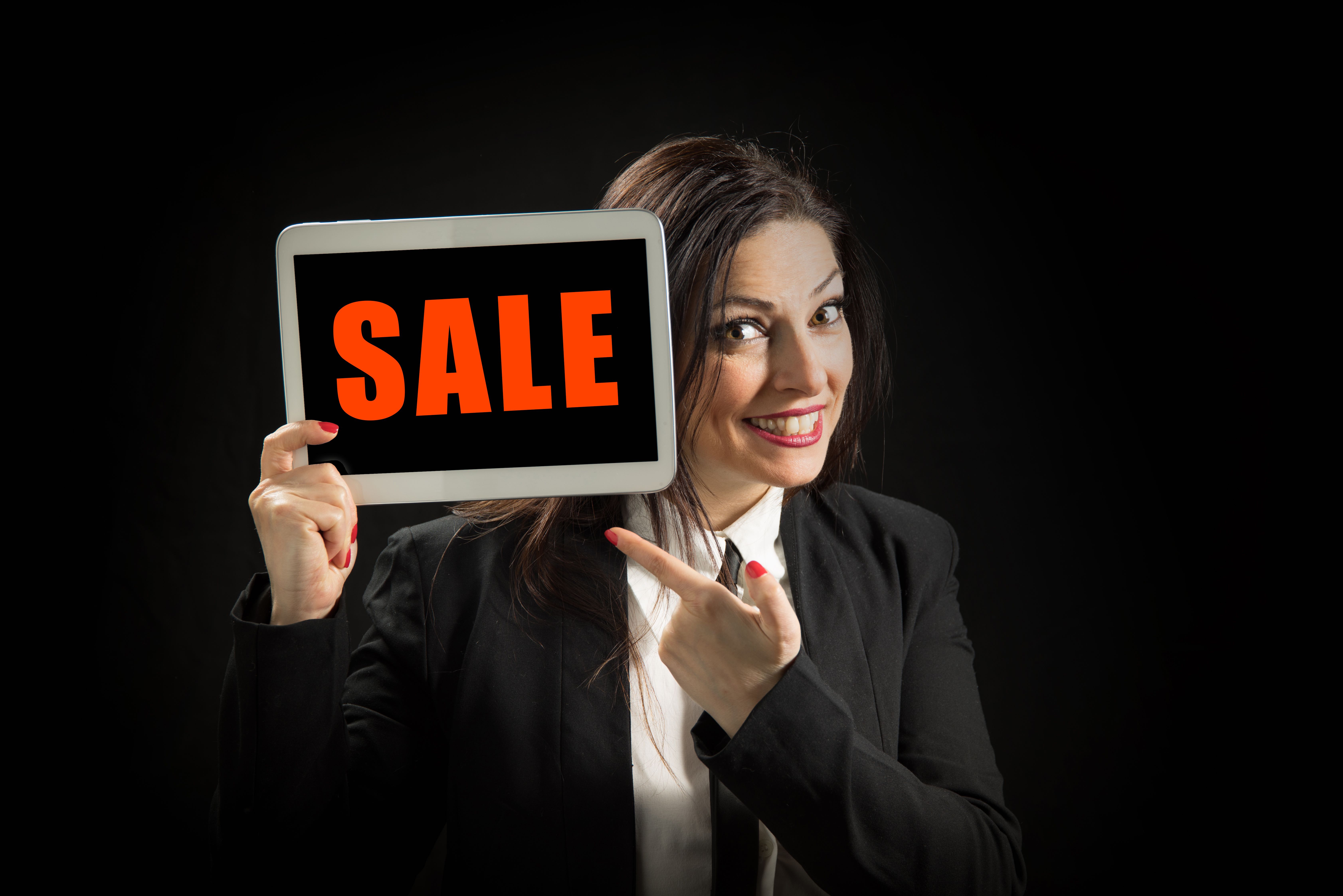 Word sale on tablet with woman holding it