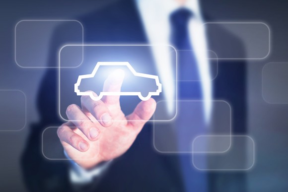 A person touching a car icon.