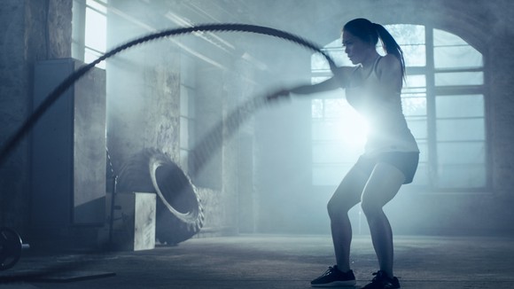 A woman working out with a rope.