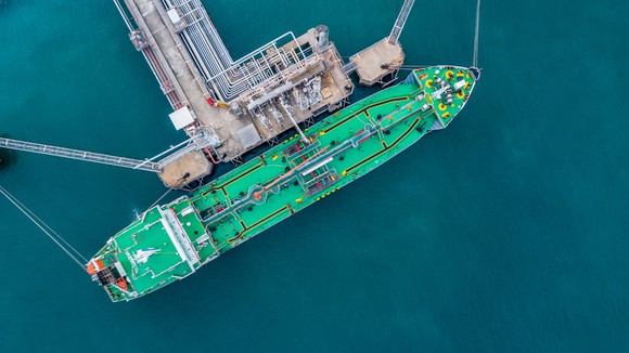An LNG tanker being filled up at a terminal.