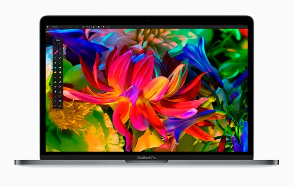 An Apple MacBook Pro showing a scene with colorful flowers.