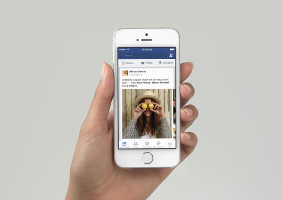 Person viewing News Feed on a smartphone