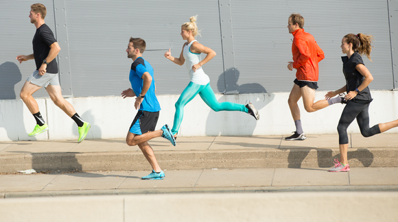 Runners in Under Armour apparel.