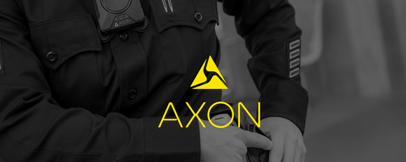Police officer with body camera pulling out stun gun