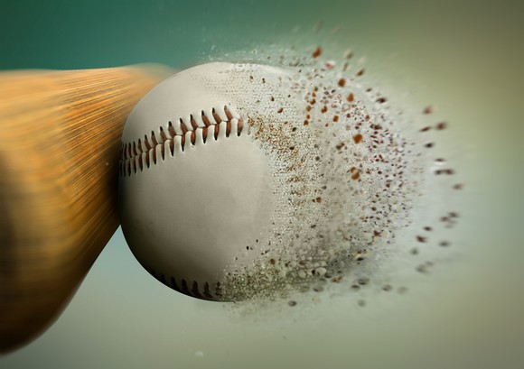 A bat crushing a baseball