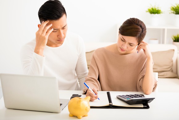 Unhappy couple doing their finances