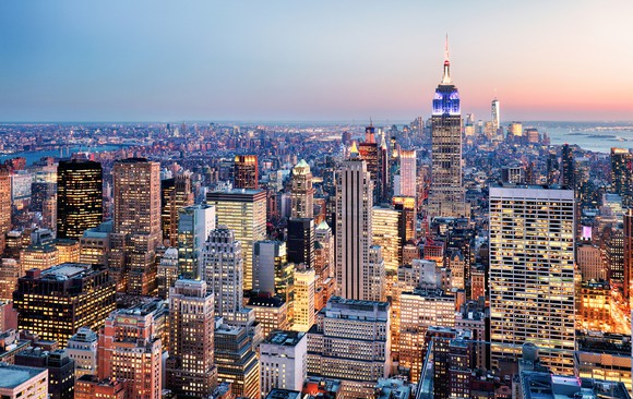 Arial view of NYC, with Empire State Building clearly visible.