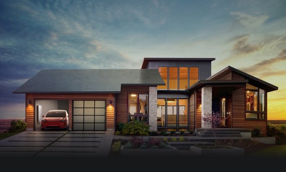 Home with a Tesla solar roof and a Model S in the garage.
